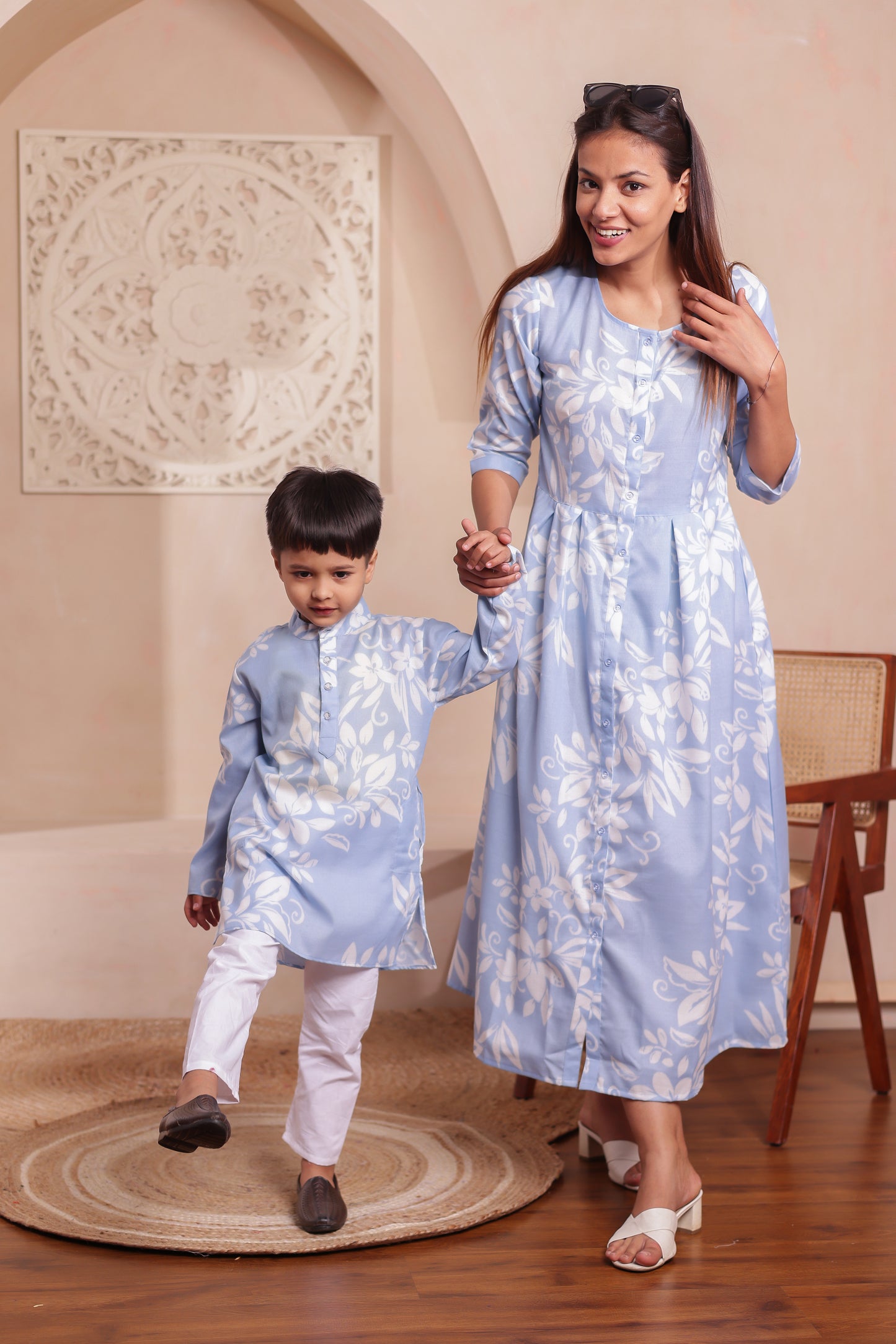 Elegant mother-son twinning combo — mother in a blue floral printed cotton dress and son in a matching soft cotton kurta. A comfortable and stylish pick for festive occasions