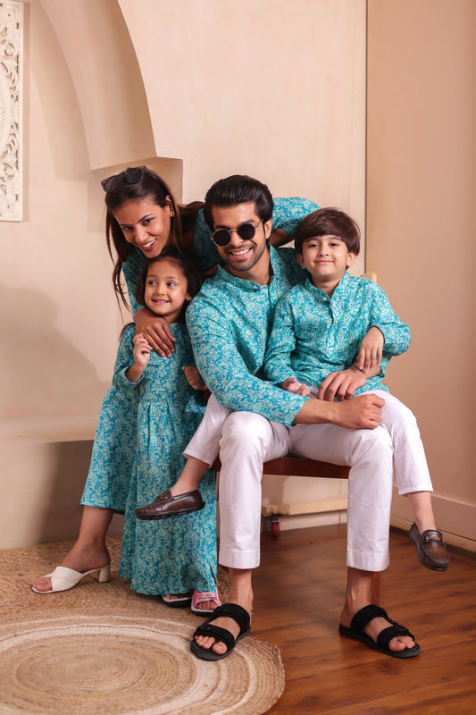 Turquoise Tales family combo featuring matching cotton kurta sets and flared dresses in turquoise blue—perfect twinning outfits for mom, dad, son, and daughter. A festive-ready family matching outfit in ethnic style with coordinated prints.