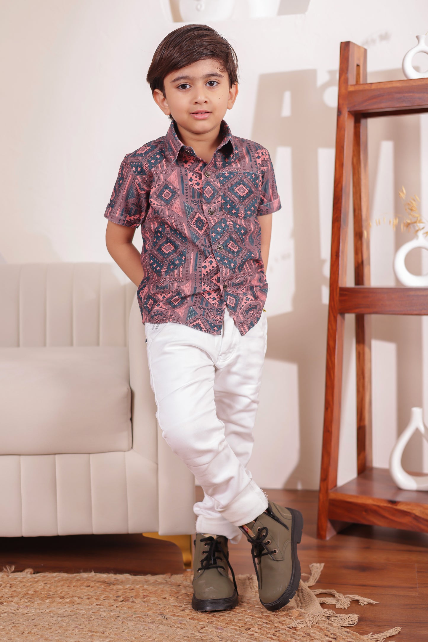 "Son in a printed cotton shirt and shorts set—designed to complement family combo outfits for coordinated looks."