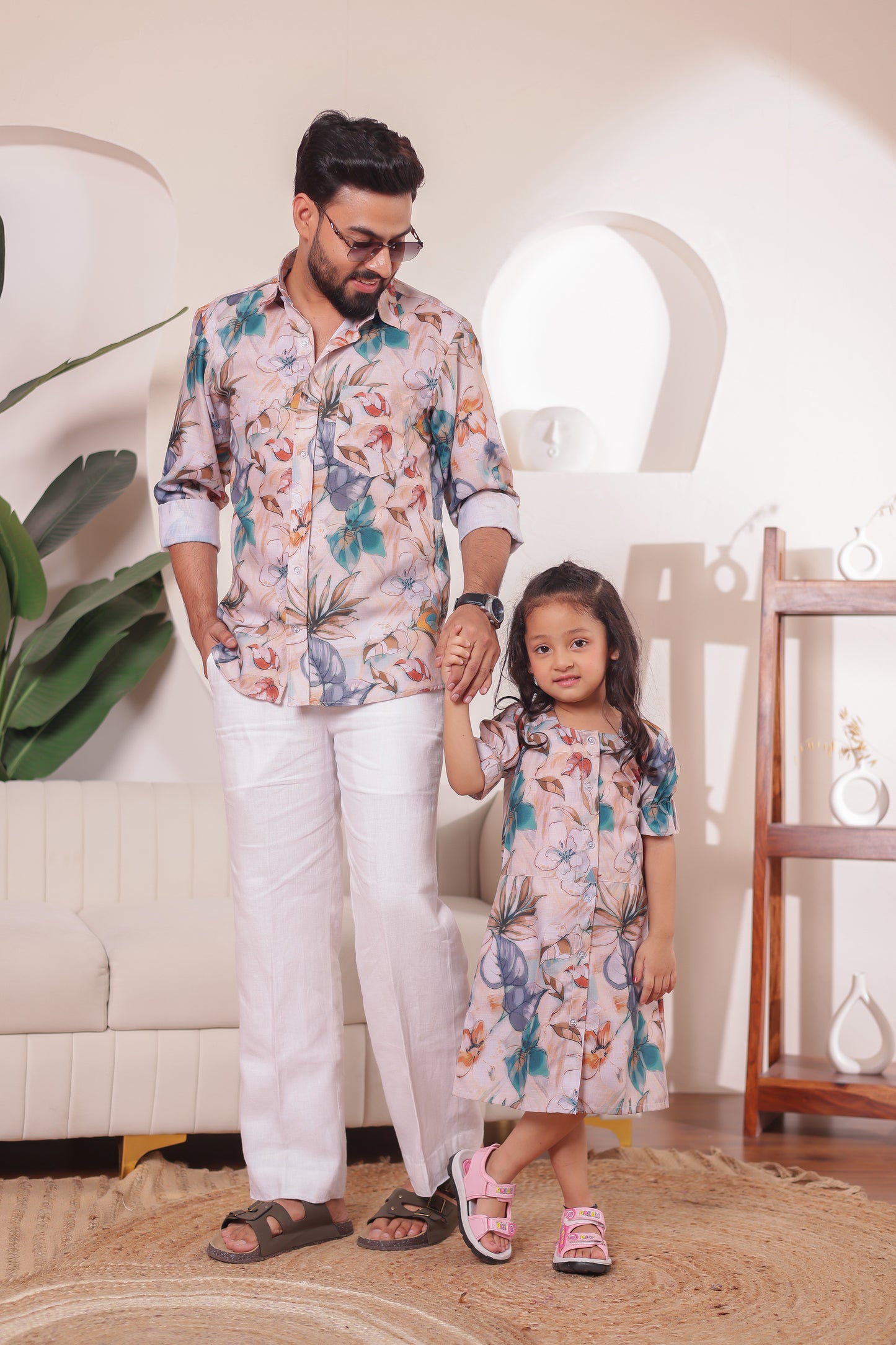 Father and daughter twinning in Petal Pop matching cotton outfits – perfect for fun family outings and festive moments