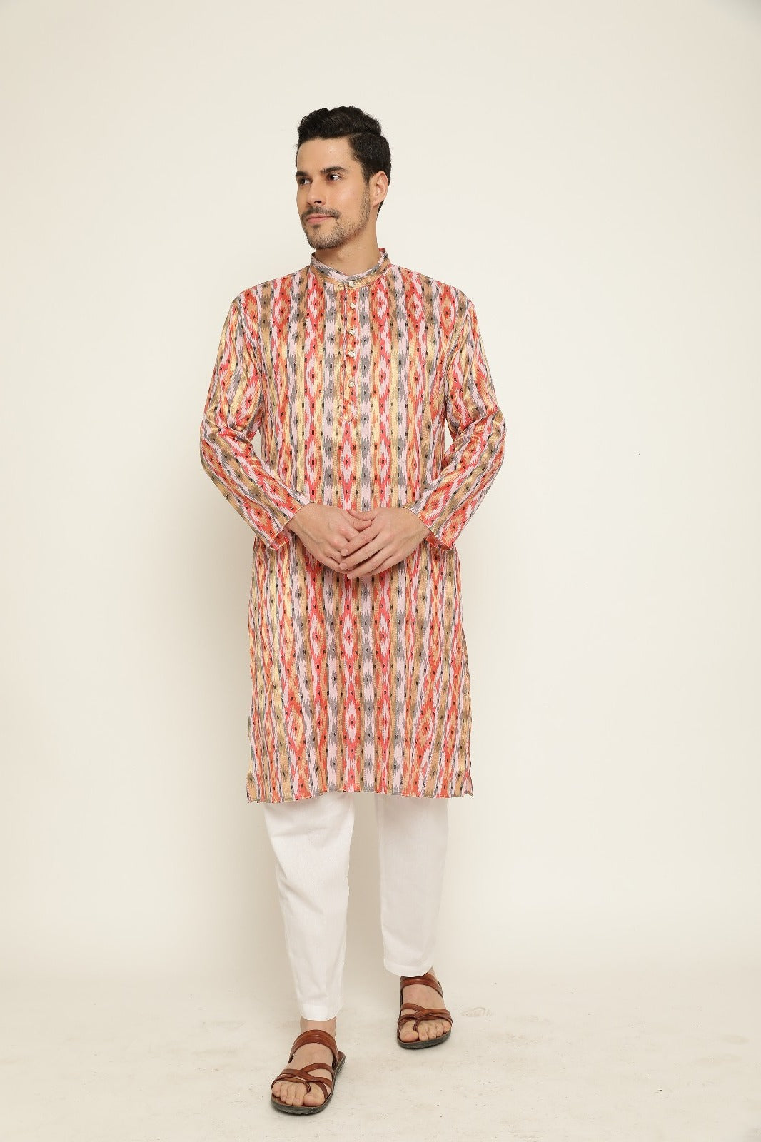 Traditional men’s orange ikat kurta pajama for festive occasions