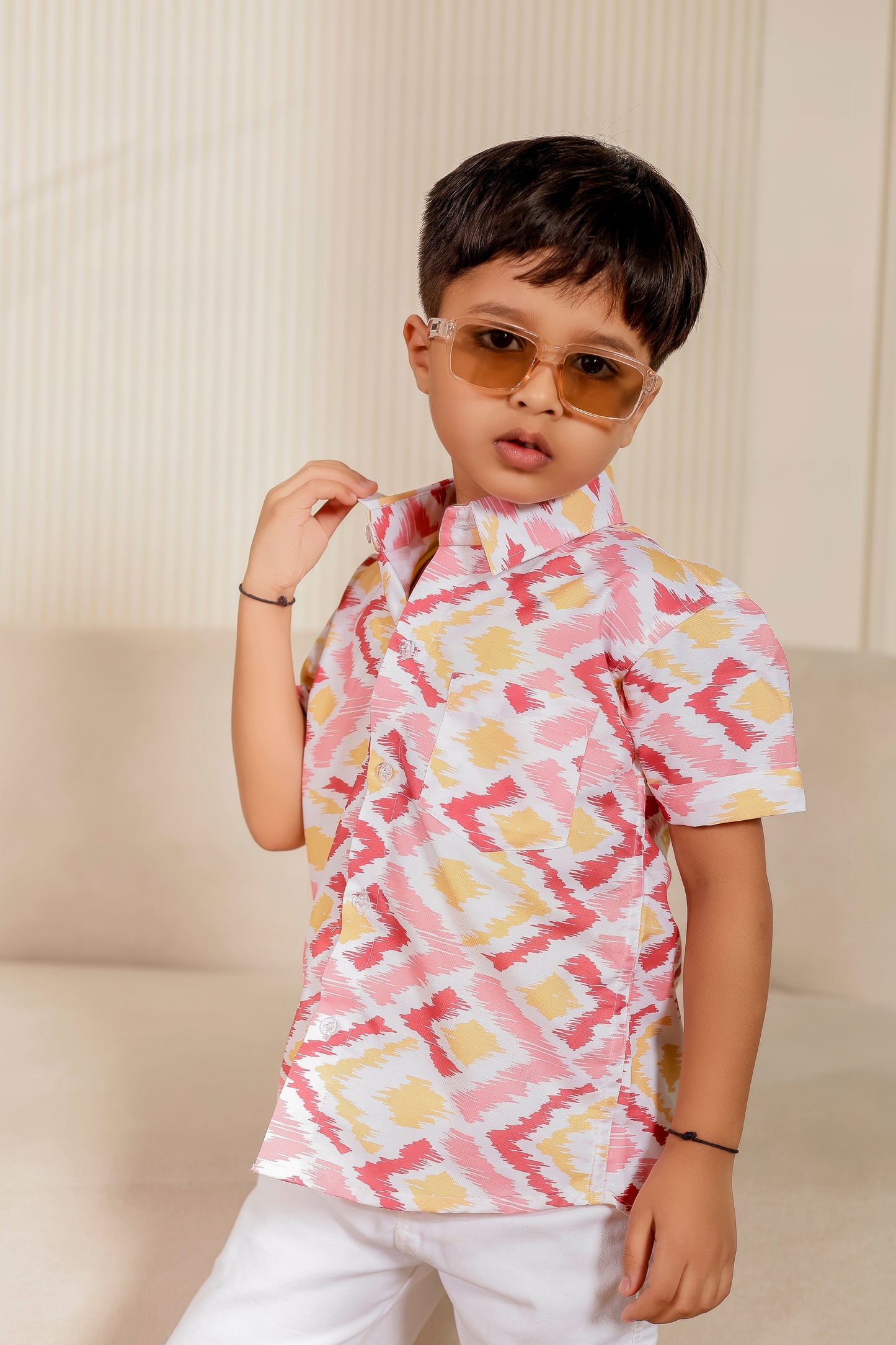 Boy wearing pastel textured Petal & Pearl shirt—smart casual style in cotton, perfect for family twinning and matching outfits with parents and siblings.
