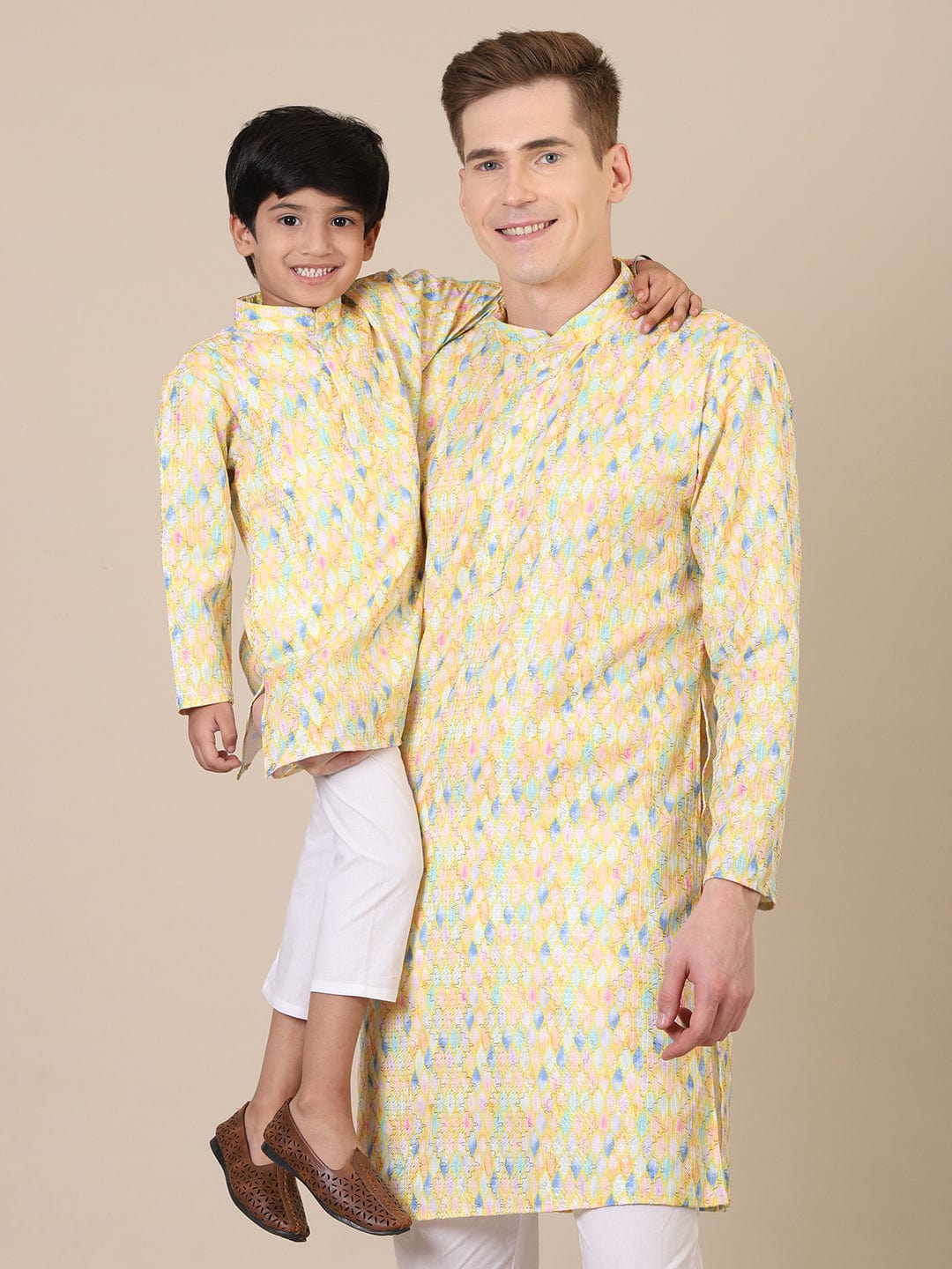 “Father and son in matching yellow kurta pajama combo, festive ethnic wear for Diwali celebration”