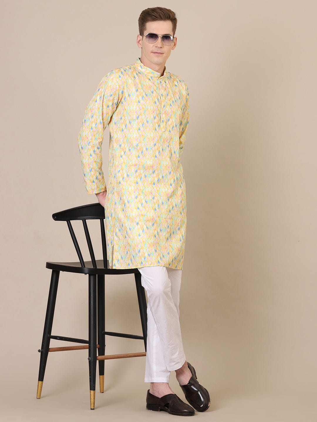 “Stylish men’s yellow kurta pajama set, traditional ethnic outfit for weddings and cultural events”