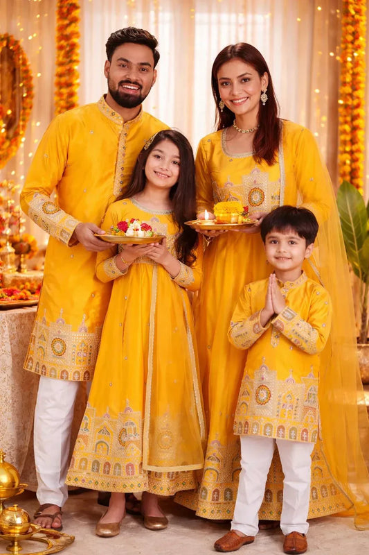 “Family matching Navratri outfits in yellow with father, mother, daughter and son wearing coordinated festive ethnic wear.”