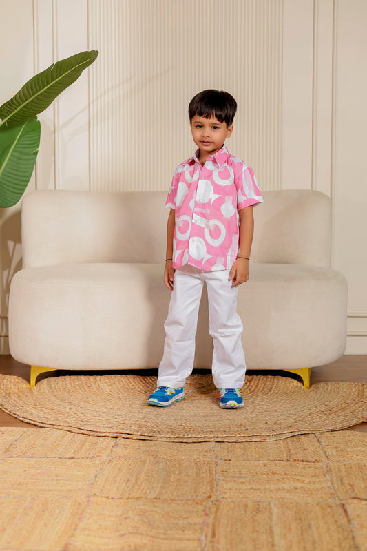 Boy’s cotton shirt in Rosy Bond pink abstract print—smart festive wear, great for twinning with dad or the whole family.