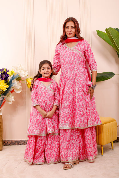 “Mother and daughter wearing royal pink matching combo outfits in twinning style”