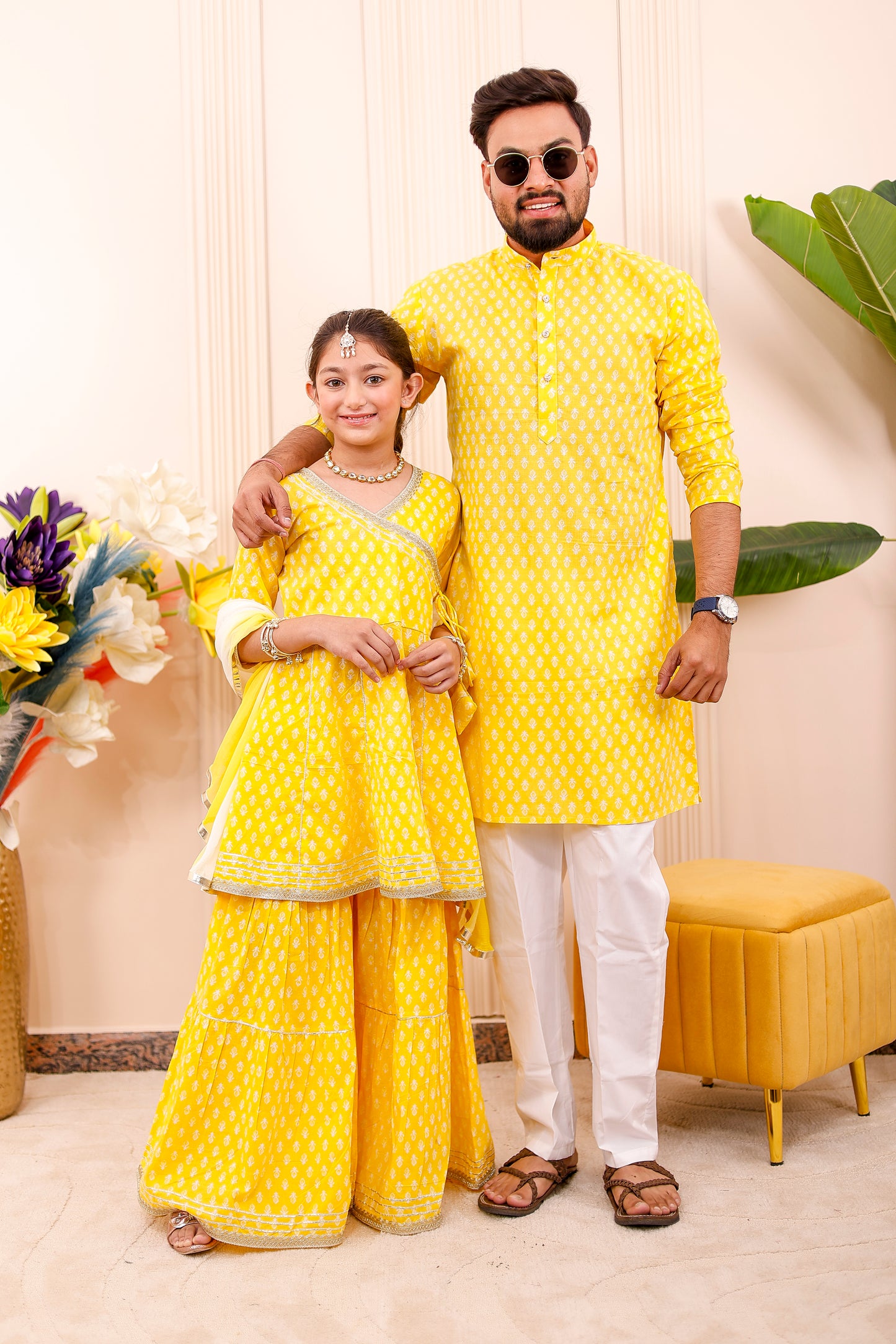 Dad and daughter wearing coordinated yellow ethnic outfits – perfect father-daughter twinning look for family photos and celebrations.