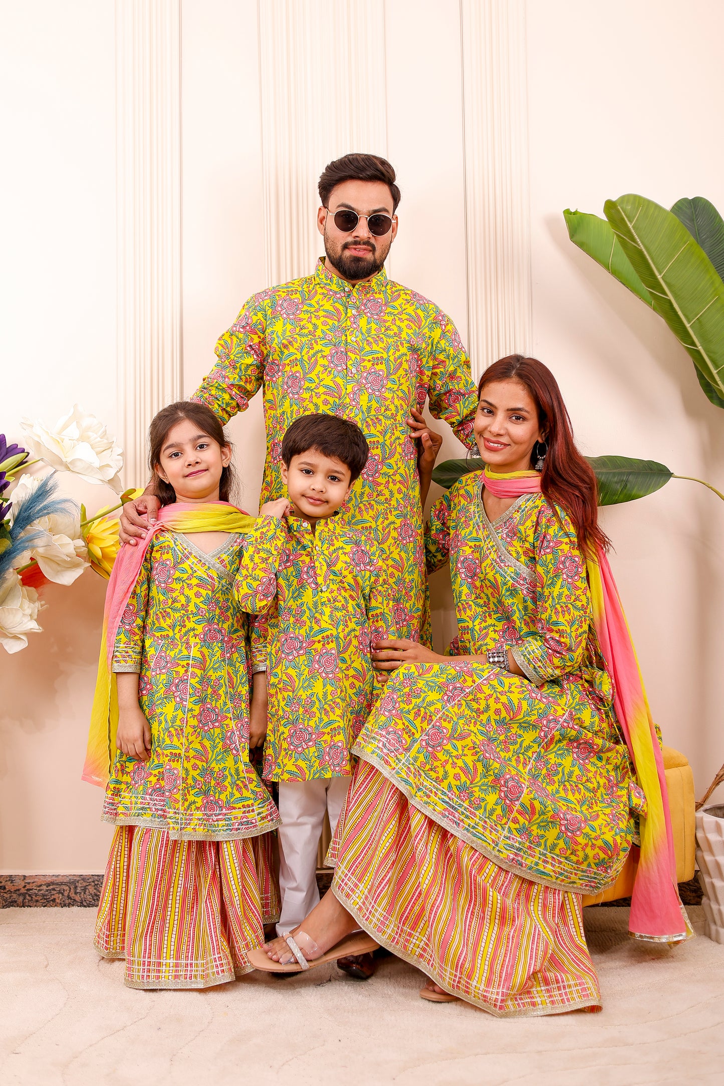 Elegant Rangoli Utsav family twinning outfits featuring coordinated styles for parents and kids