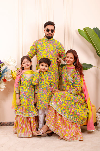 Elegant Rangoli Utsav family twinning outfits featuring coordinated styles for parents and kids