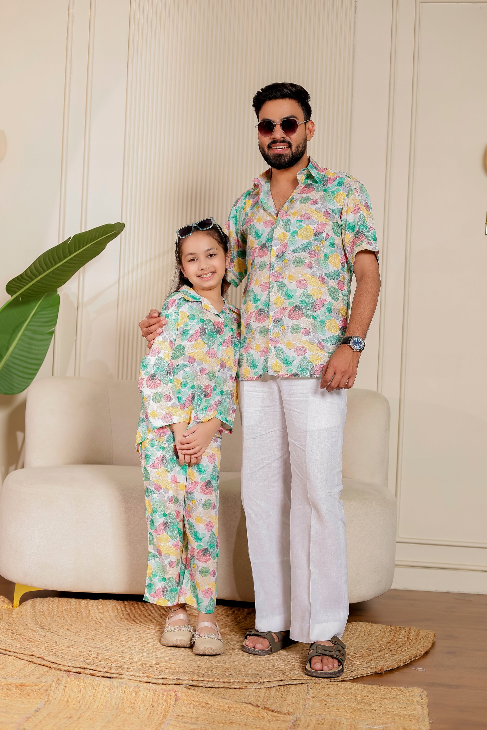 Father and daughter twinning combo in Leafy Love print – pink cotton shirt for dad and matching co-ord set for daughter, perfect for casual family days.
