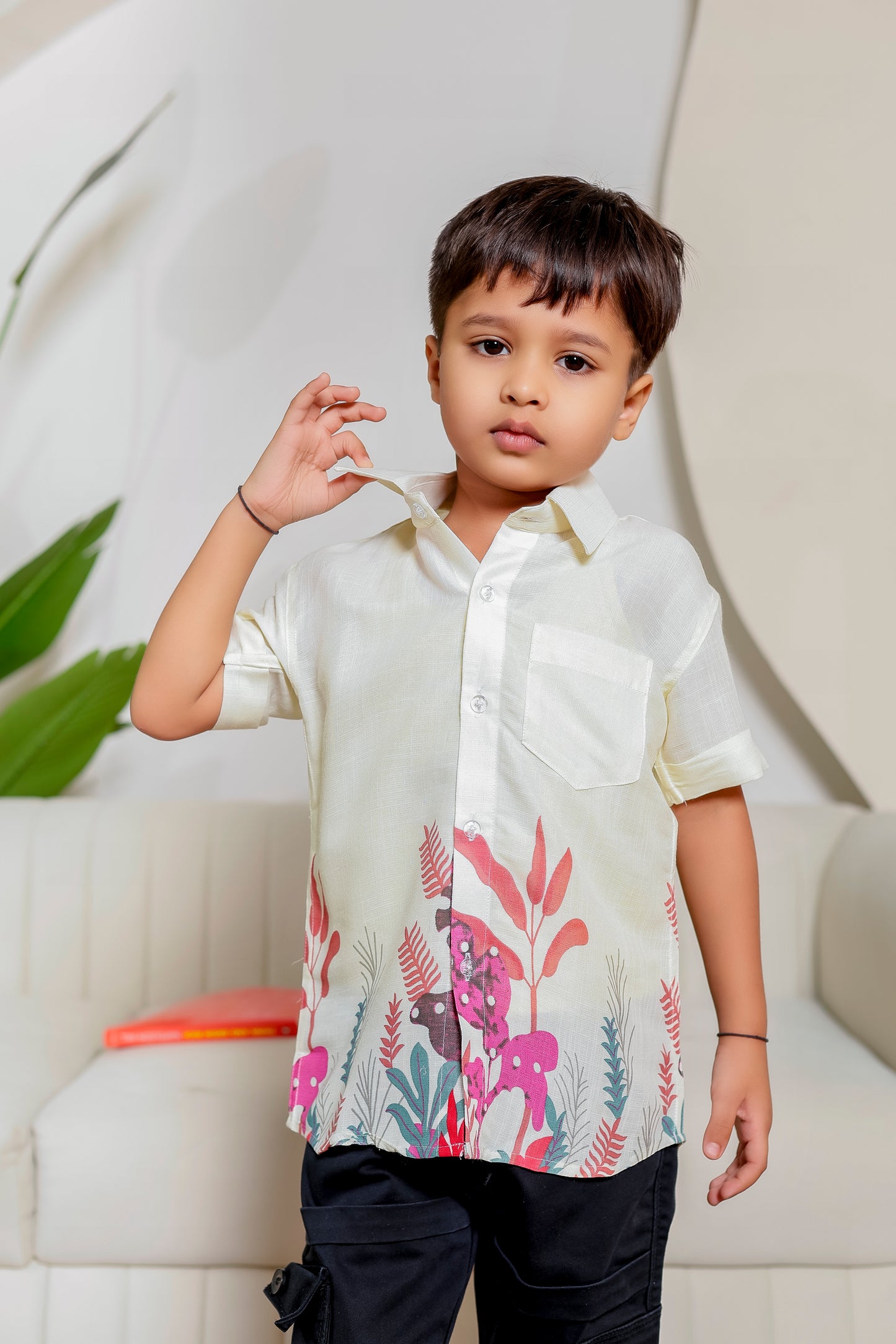 Boy wearing Blush Botanical cotton floral shirt from the family matching outfits collection, perfect for coordinated family twinning.