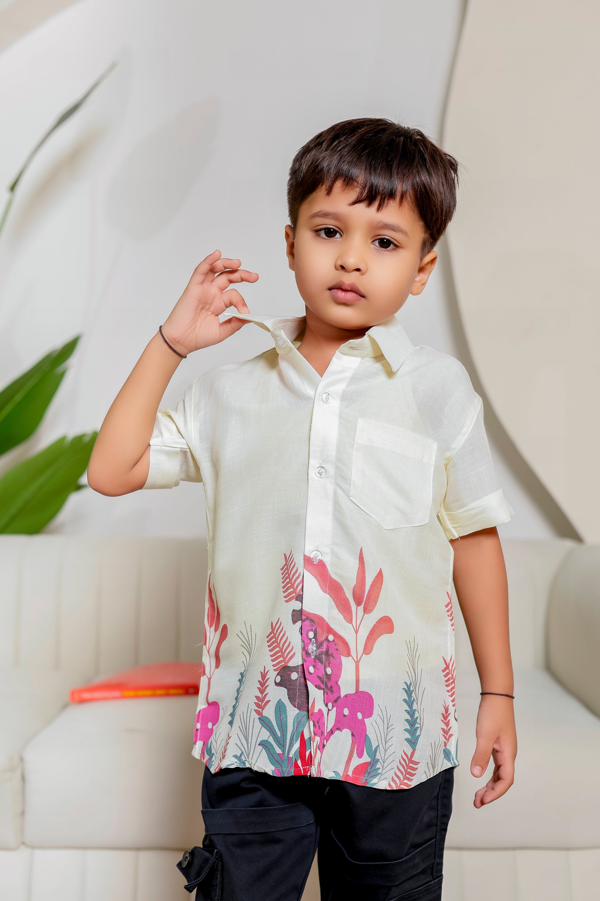 Boy wearing Blush Botanical cotton floral shirt from the family matching outfits collection, perfect for coordinated family twinning.