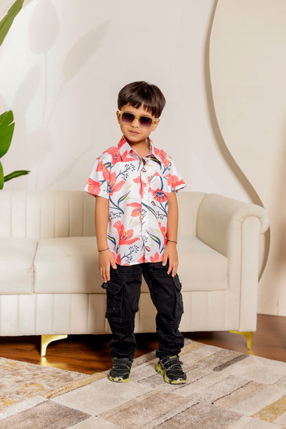 Son in coral bloom floral printed cotton shirt. Trendy casual wear for kids, ideal for twinning with dad or sibling.