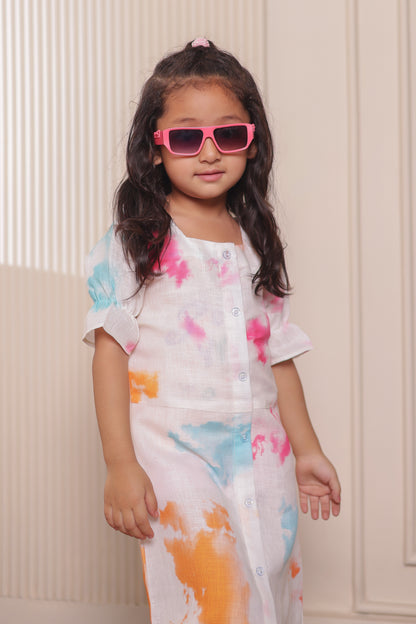 Girl in Cotton Candy matching dress in pastel splash print — cute family matching clothes for daily wear. Matching family dress for twinning moments.