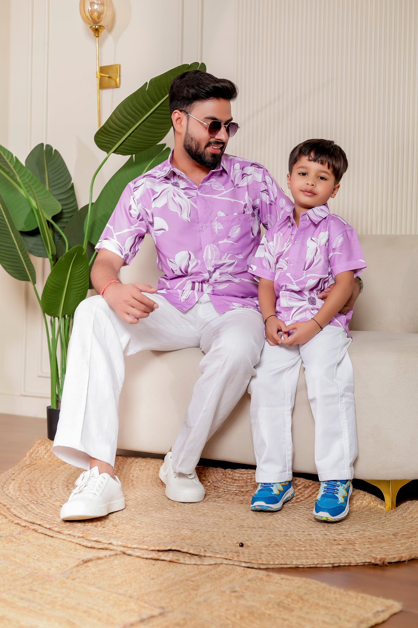 Father and son matching in Lilac Legacy floral print shirts in soft cotton. Great for casual events, travel looks, and father-son bonding in style.vacation

