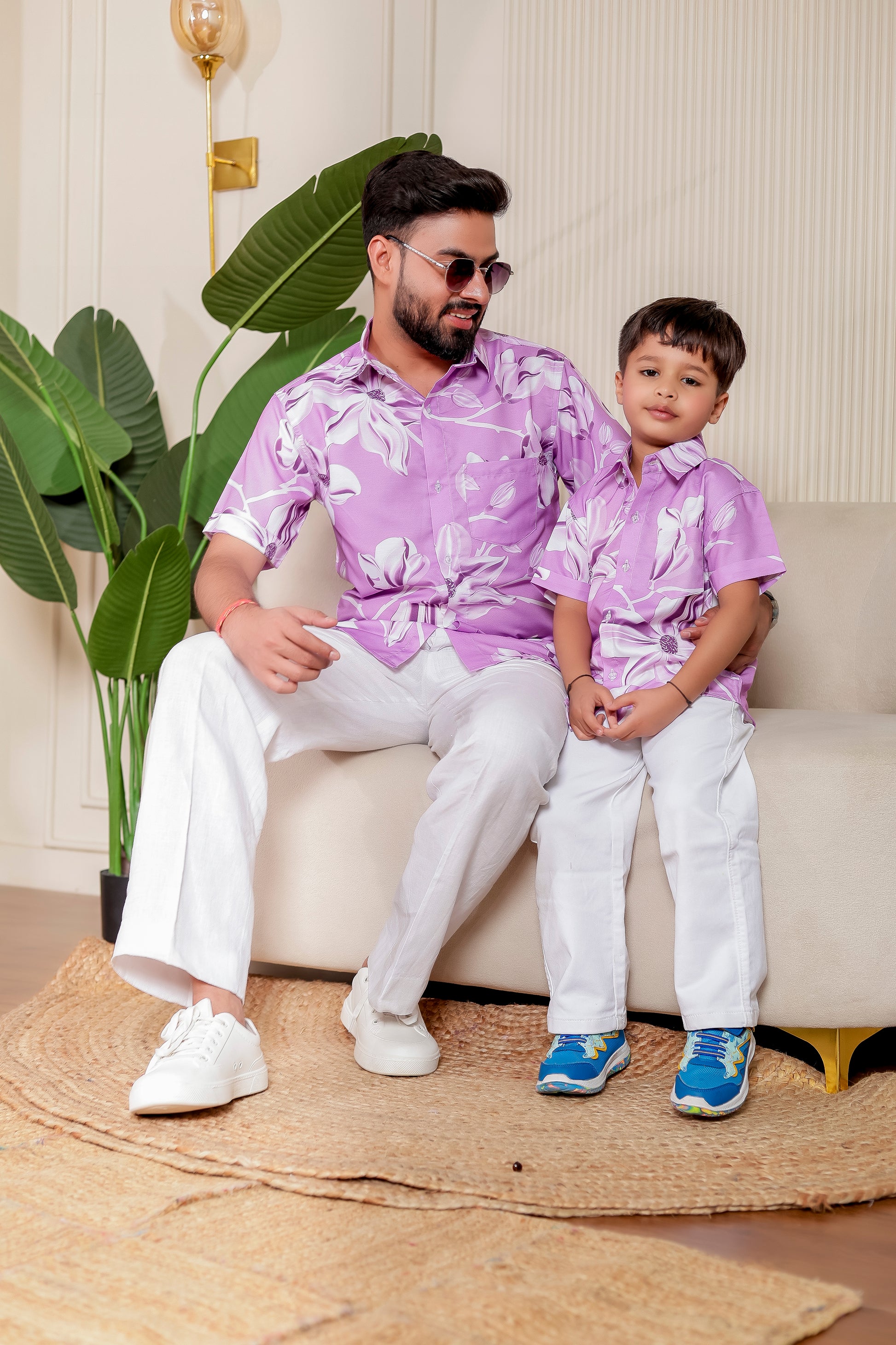 Father and son matching in Lilac Legacy floral print shirts in soft cotton. Great for casual events, travel looks, and father-son bonding in style.vacation

