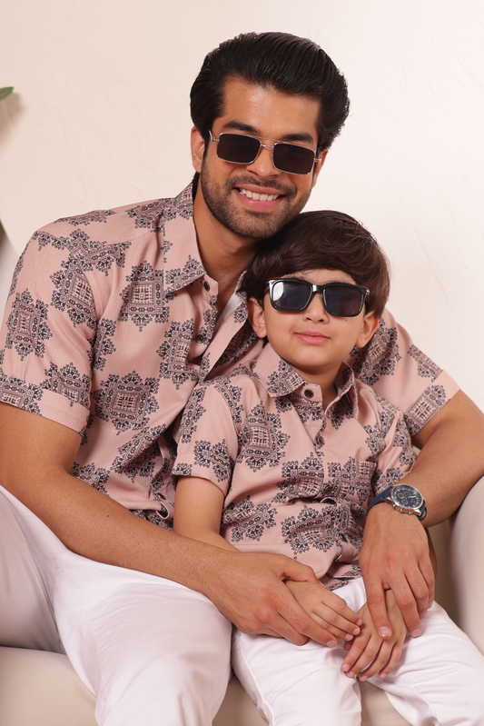Father and son dressed in Modern Mehfil outfits, reflecting a refined contemporary style suitable for family gatherings and memorable moments together.