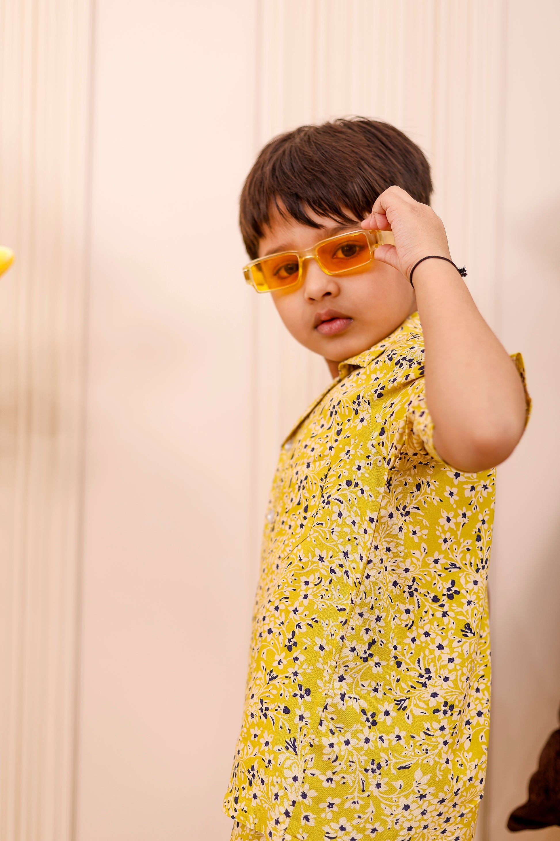 Close-up view of boy wearing Summer Sunshine co-ord set showcasing fabric texture, shirt details, and matching shorts in breathable cotton blend.