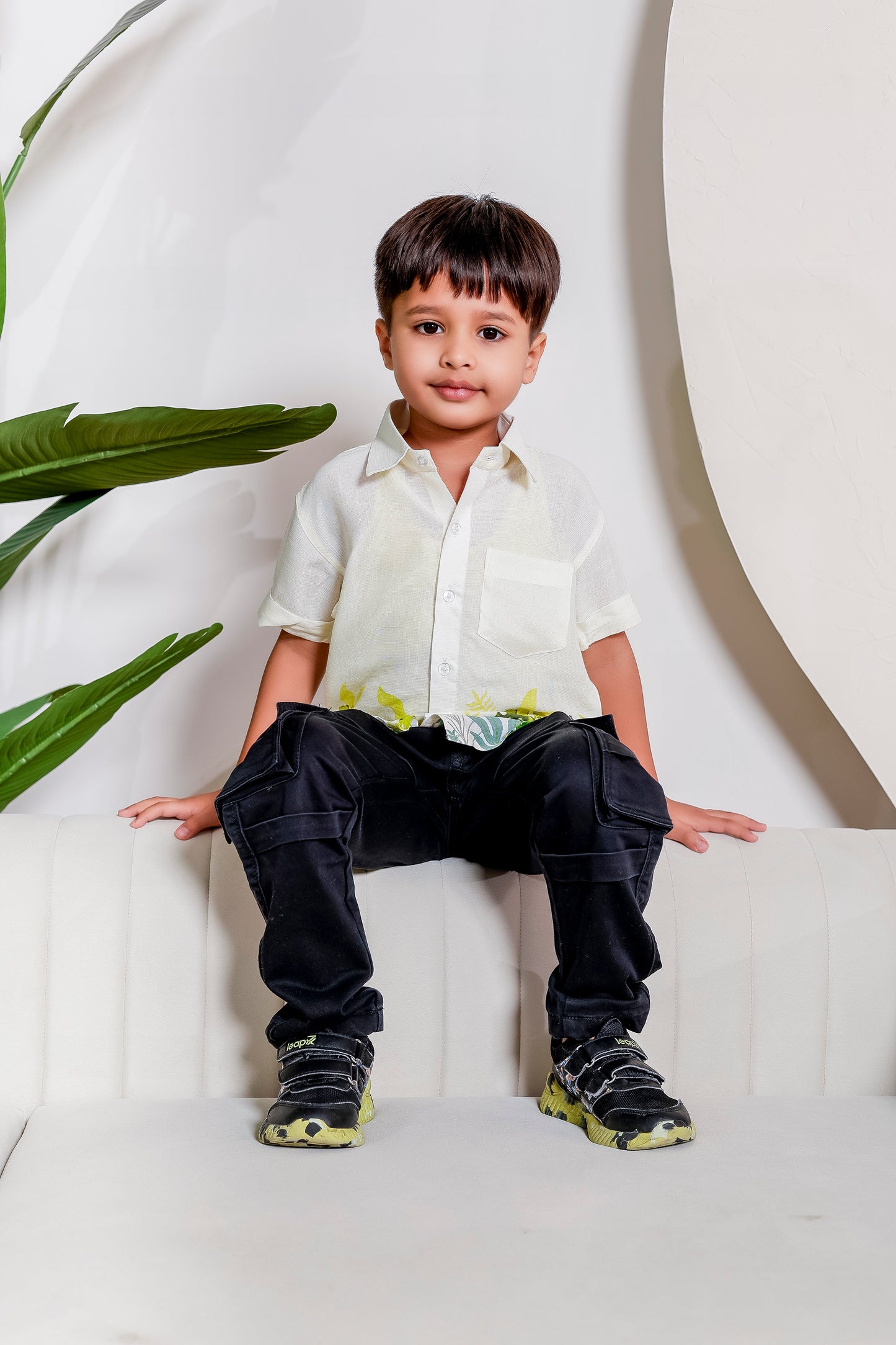 Boy wearing Verdant Vibe cotton shirt from the family matching outfit combo, styled in a fresh green tone for coordinated festive and casual looks.