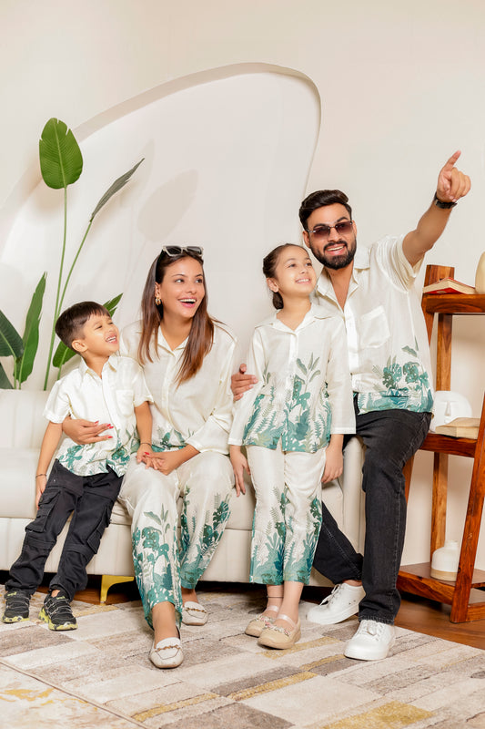 Family matching outfits and family combo dress in soft cotton with green tropical prints, featuring coordinated co-ord sets and matching shirts for mom, dad, son, and daughter.