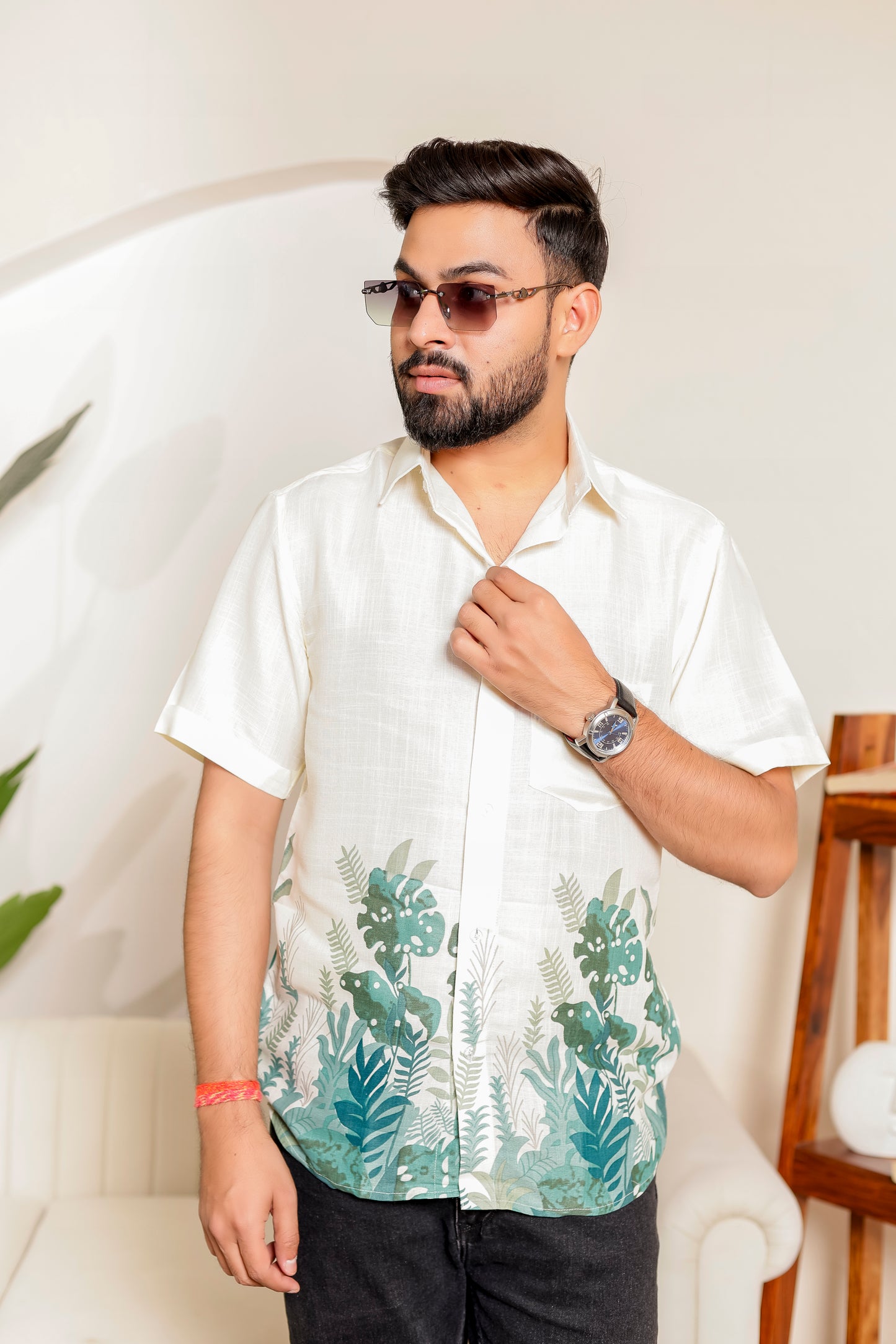 man wearing a soft cotton green tropical print shirt – comfortable and stylish, ideal for casual days or coordinated family matching outfits